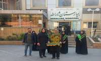 حضور خادمین رضوی حامل پرچم سبزحرم مطهر رضوی در بیمارستان ثارالله